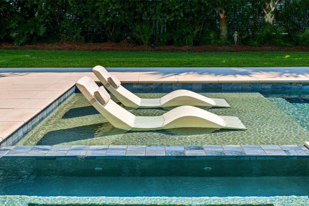 Sun loungers on a tanning ledge - Cox Pools